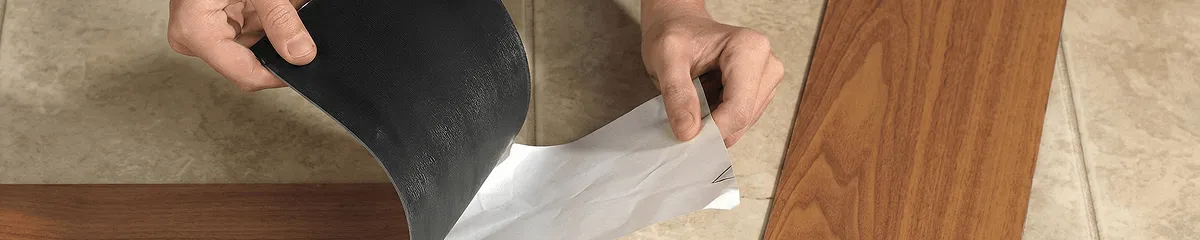 A professional installing vinyl flooring in Tacoma, WA